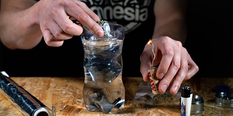 Gravity bucket bong: Gently submerge the bong into the water