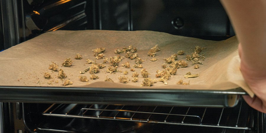 Place the ground plant material on a baking tray