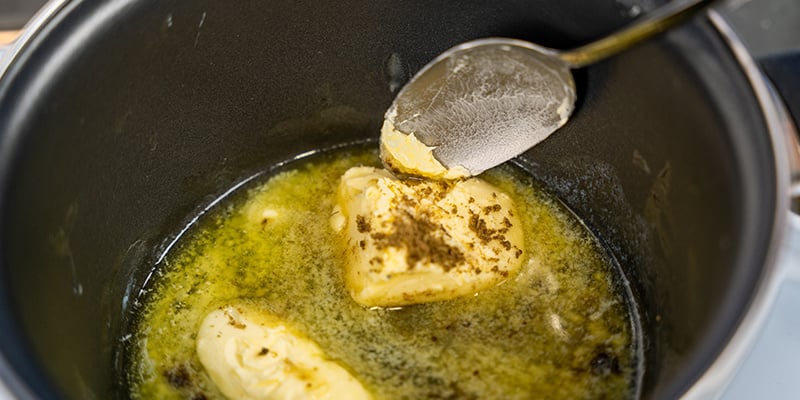 Heat the coconut oil or butter in the pan over low–medium heat.